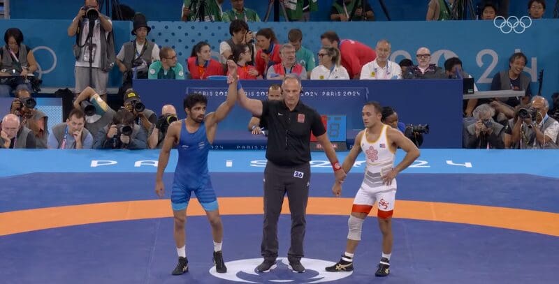 Aman won bronze medal by defeating Darian Cruz of Puerto Rico